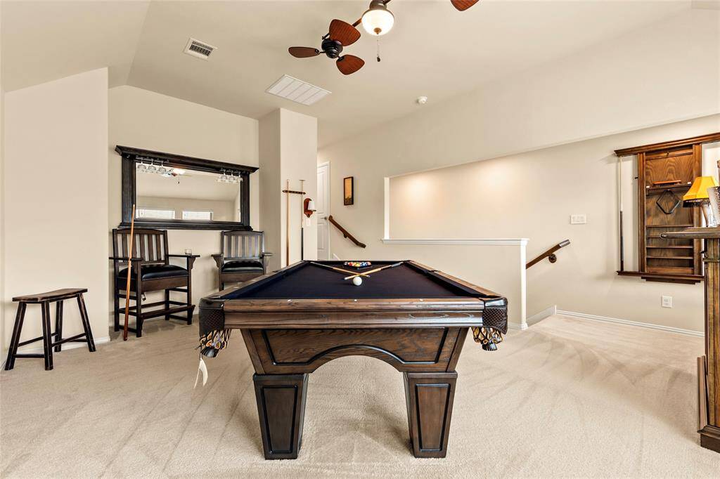 Spacious upstairs room is currently being used as a game room but could easily be a 4th bedroom with a full bathroom and closet too.  Huge walk-in attic space is well organized and energy efficient with radiant attic barrier.