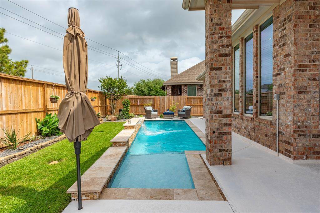Full gutters, piped directly in ground with hard PVC drains and drain grates. Full sprinkler system with diagram and control mount located in the garage.