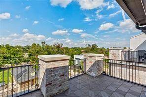 Similar terrace outside the Primary Suite looking over 36 acres ripe for new development. No brick columns.