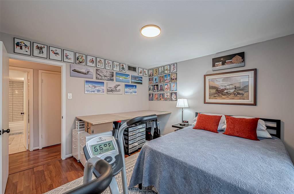 Secondary bedroom (12X12) is currently being used as a hobby room and also has laminate flooring.  There is no carpet.