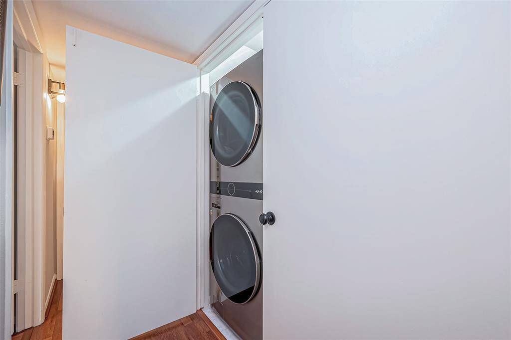 New full sized washer and dryer that goes with the property is in the hallway.
