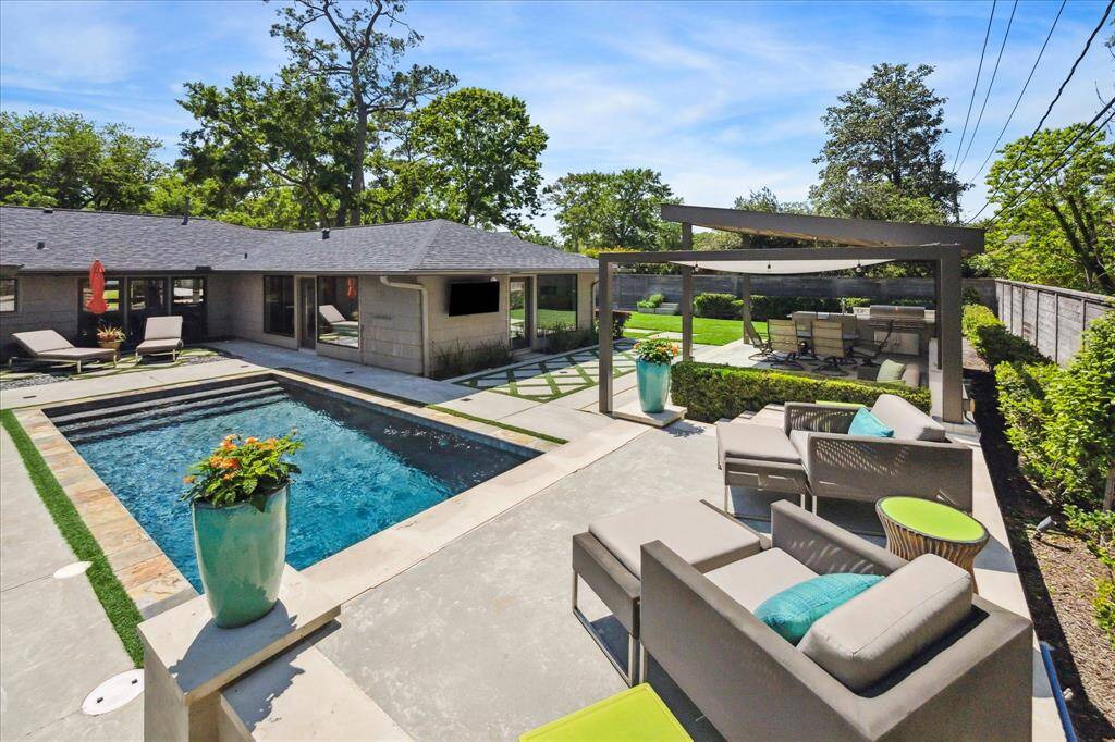A view from on top of the sundeck overlooking the wonderfully paved backyard.
