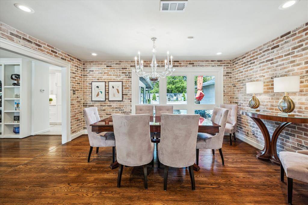 This dining room overlooks the sun deck and pool in the backyard!