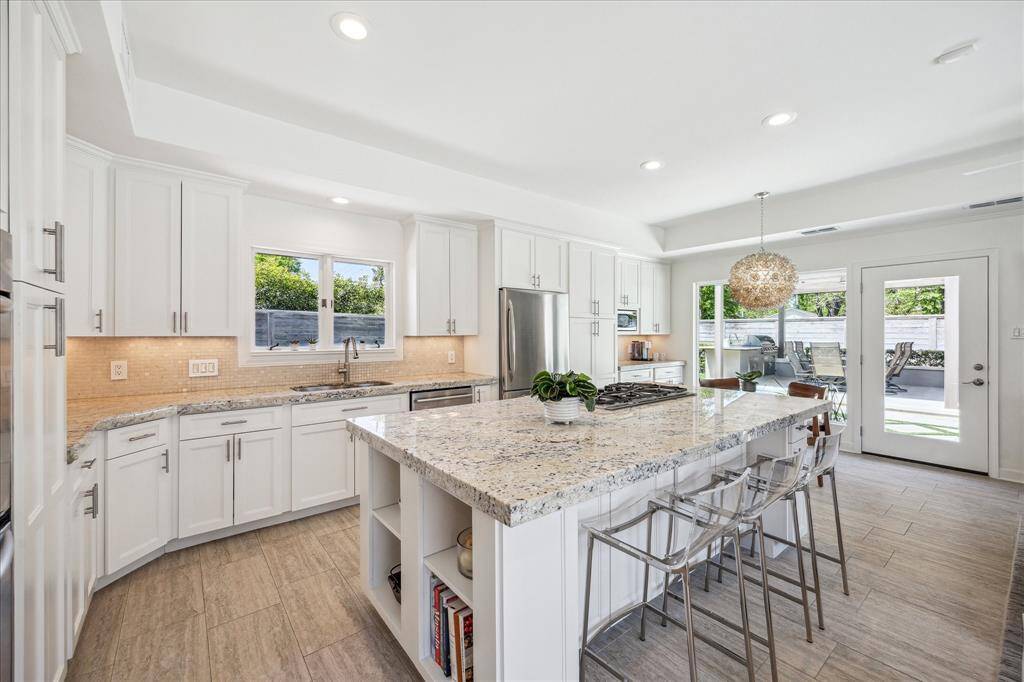 Here is your kitchen with a gorgeous very large island with seating.