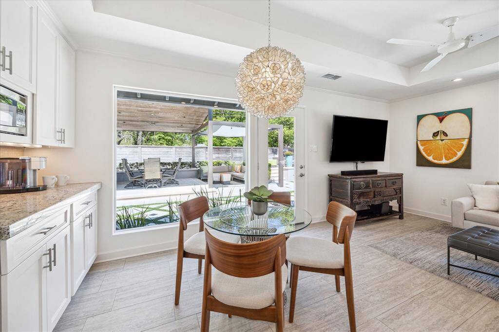 A bright breakfast area off the kitchen allows for dining with a view of your outdoor living area.