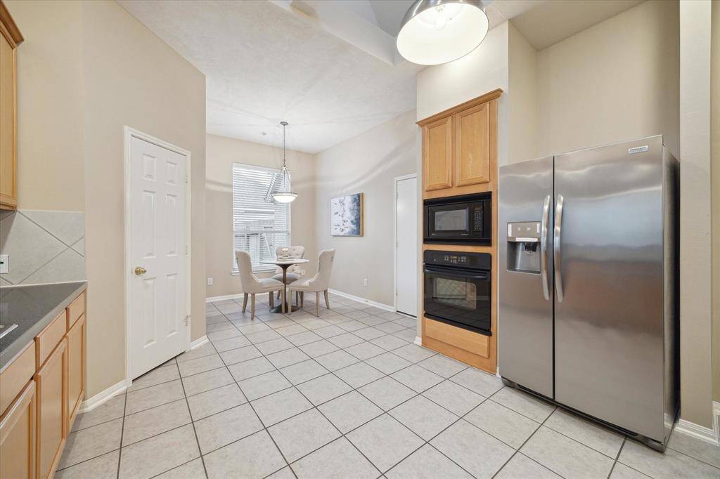 Another view of this expansive kitchen and breakfast room.  This light filled space has a large window and skylight above.