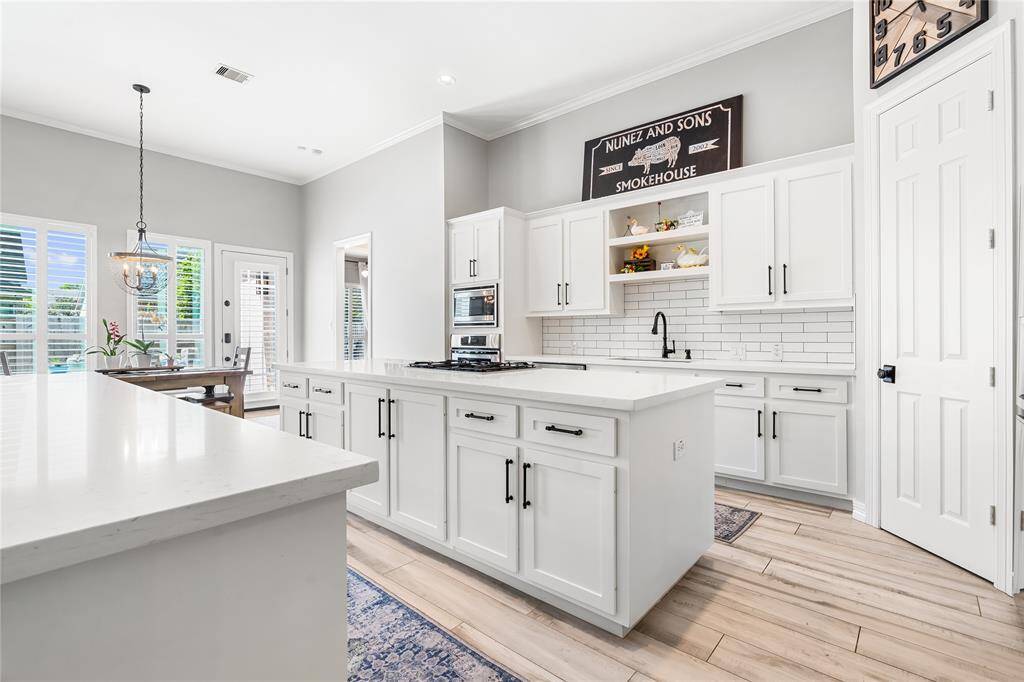 COMPLETELY UPDATED KITCHEN WITH SHAKER CABINETS AND SUBWAY TILE BACKSPLASH.