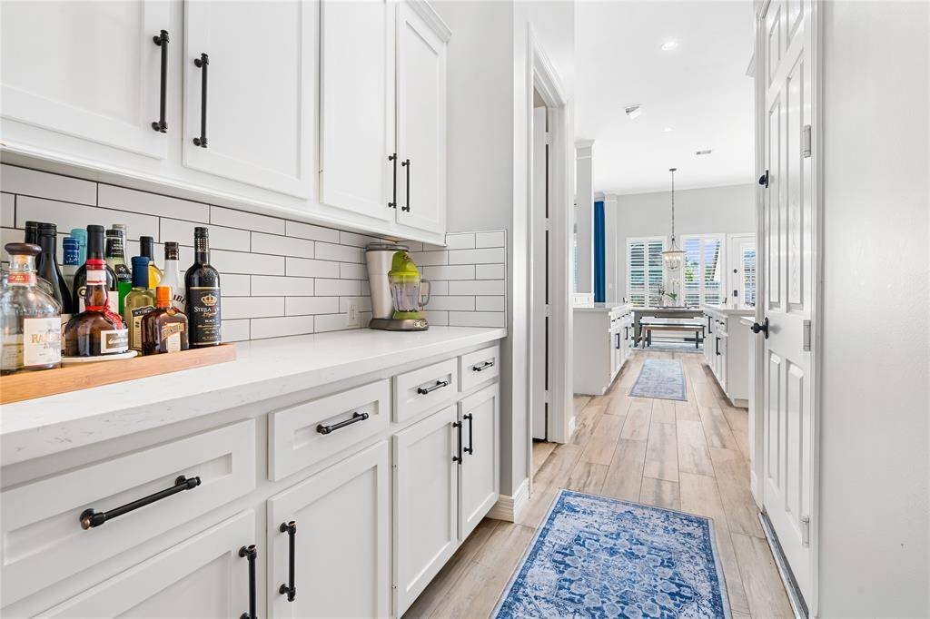 BUTLER'S PANTRY FOR ADDED STORAGE AND CONVENIENCE.