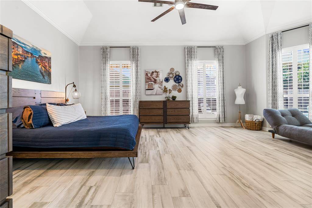 MASTER SUITE FEATURES AN ABUNDANCE OF SPACE WITH SITTING AREA.