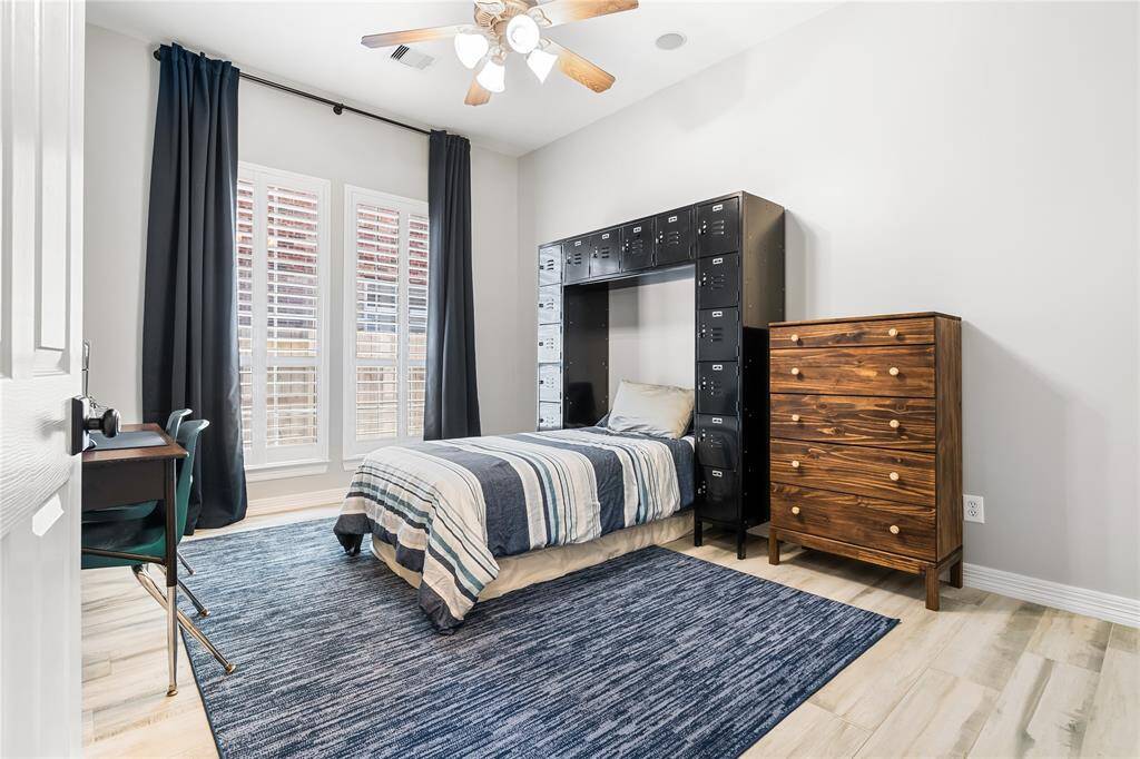 ONE OF THE SECONDARY BEDROOMS.