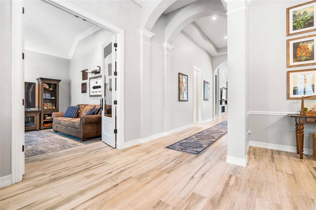 YOU'LL FIND THE UPGRADED FRENCH DOORS LEADING INTO THE STUDY ON THE LEFT OF THE ENTRY.