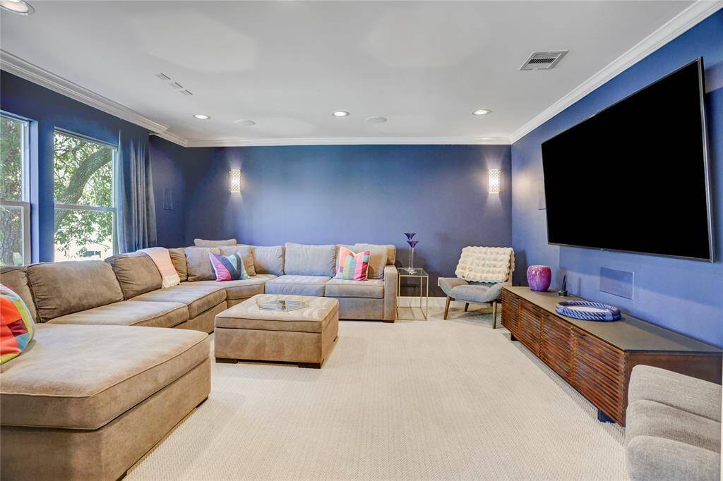 Movie nights in are something to look forward to in this upstairs media room with custom accent lighting, black out curtains, and is wired for surround sound.  Leave the pocket doors open to use this room as lounge space connected to the open game room.