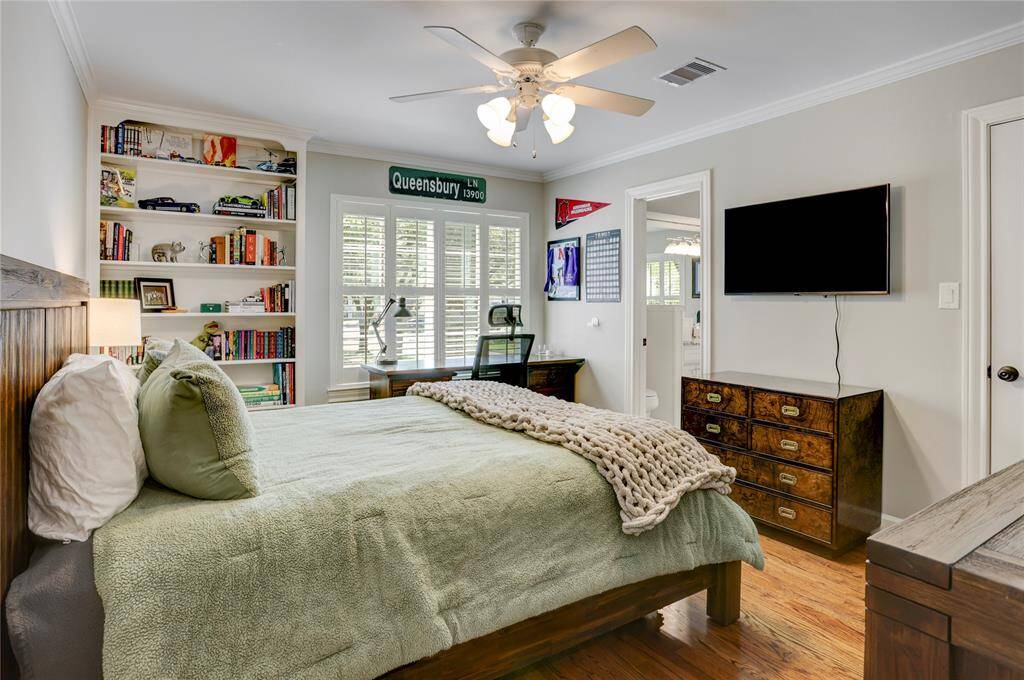 This adjoining secondary bedroom has wood floors, walk-in closet, built-in bookcase and also has entry to the dual access bathroom.