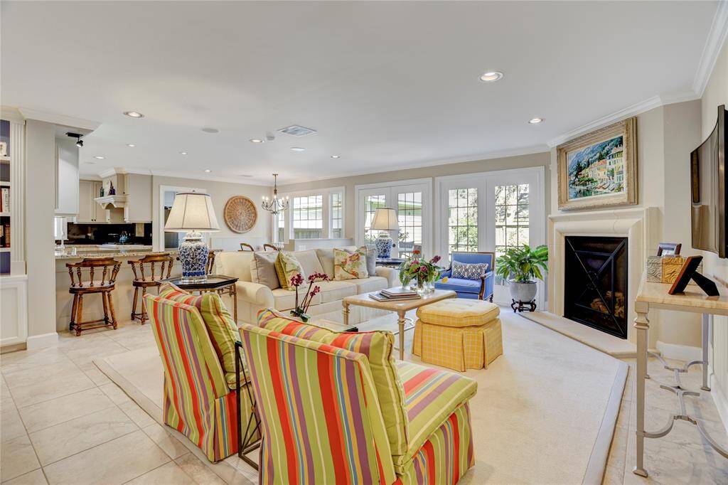 Open concept living spaces flow easily one to another. The family room is so light and bright with a wall of French pane windows and doors. Windows and doors have been updated to be insulated/Low-E.