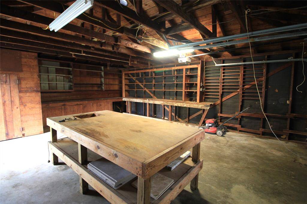Loads of cabinets and storage shelves in the oversized garage
