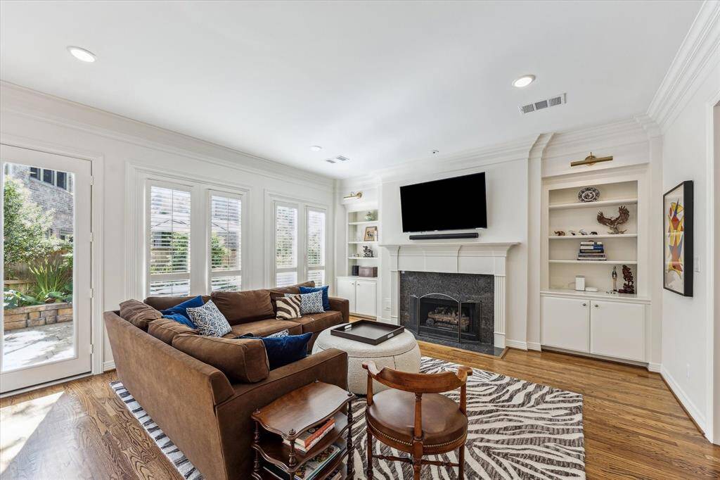 Natural light consumes all the rooms in this home with its tall windows.