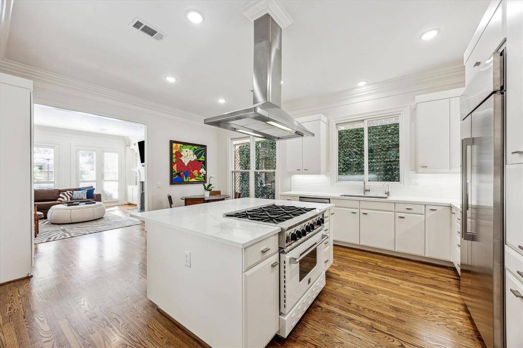 Kitchen opens up to family room.