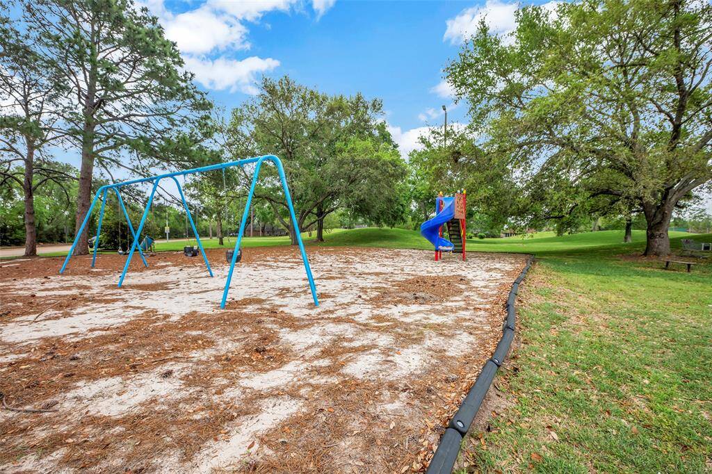 A dedicated children's play area within the community, featuring safe and engaging equipment, providing a delightful space for kids to play and socialize.