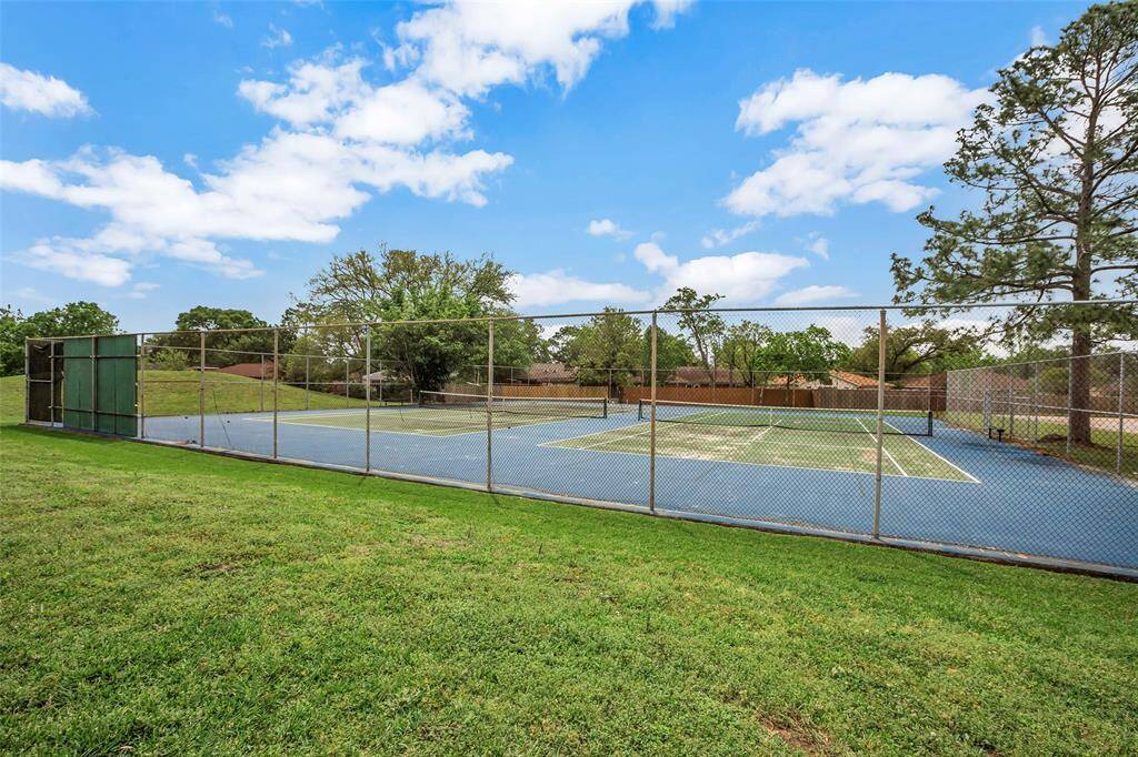 For sports enthusiasts, the community offers a well-maintained tennis court, providing excellent facilities for both casual play and competitive matches.