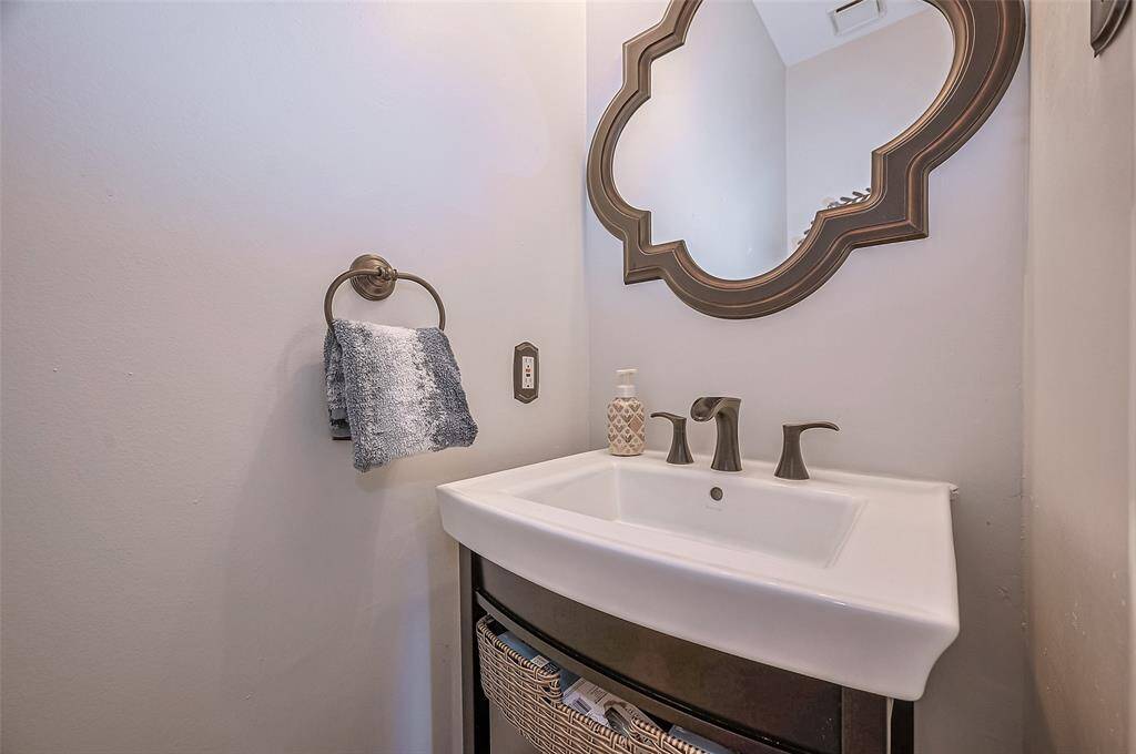 Convenient half bath located near the primary suite, just off the living room.