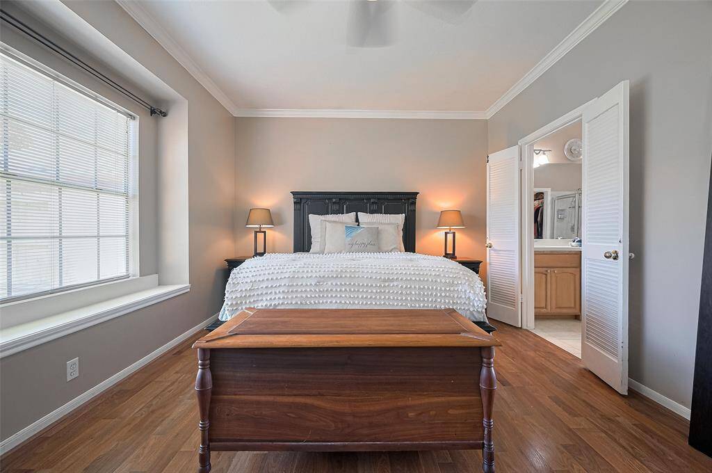 Luxurious owner's suite featuring high ceilings and elegant crown molding.