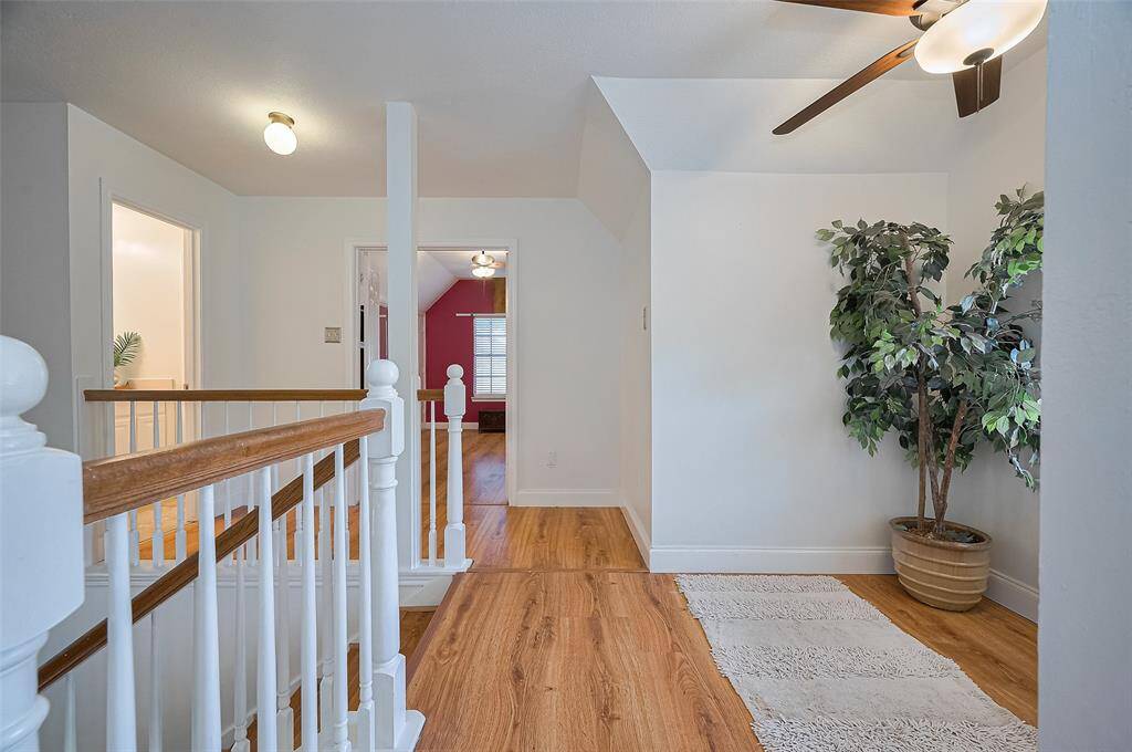 Upstairs offers a versatile room with double doors, perfect as a game room, bedroom, study or fitness room!