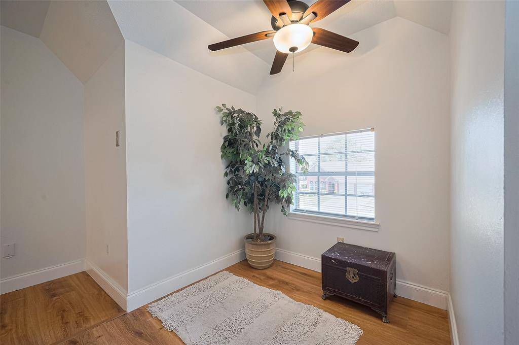 Bedroom #2 offers a front yard view and features a spacious walk-in closet.