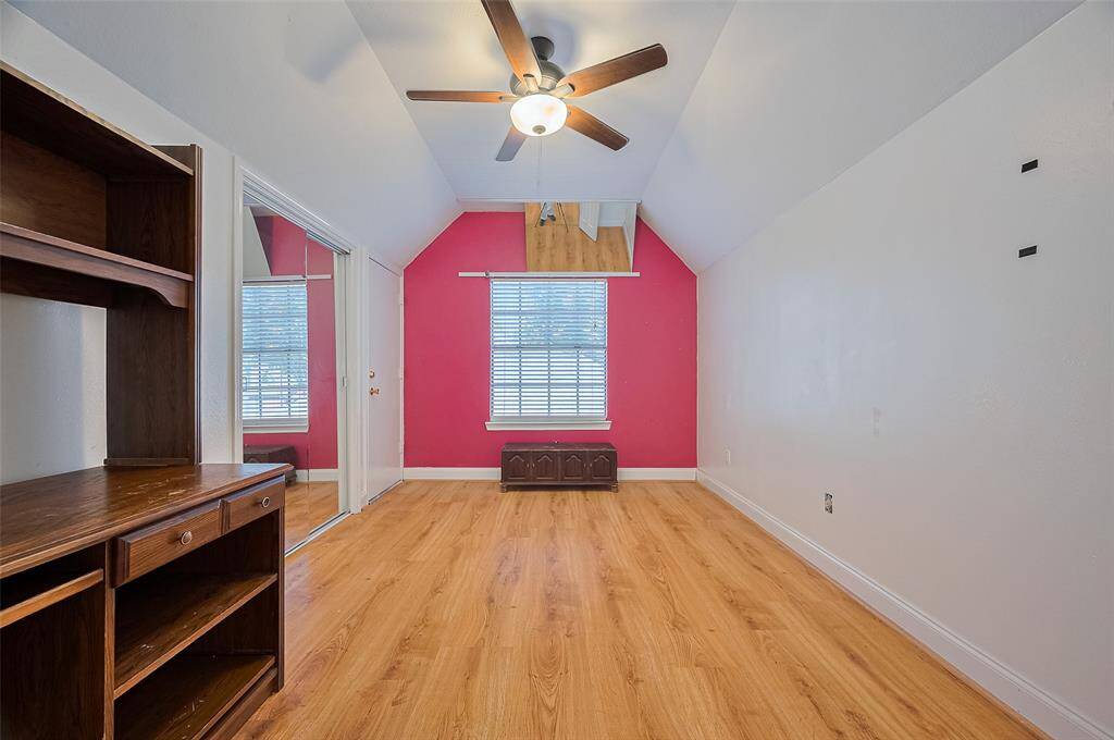 Bedroom 4 features a sliding mirrored closet and convenient full attic access.