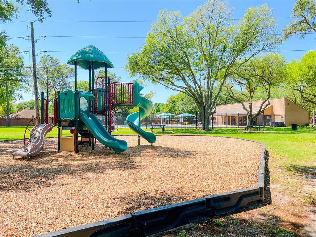 Enjoy endless fun in this serene outdoor space featuring a playground, refreshing pool, and convenient picnic tables. Perfect for relaxation and family gatherings.