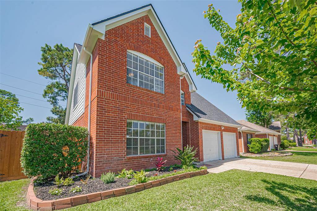 Solid brick construction surrounds the entire first floor, ensuring durability and classic charm.
