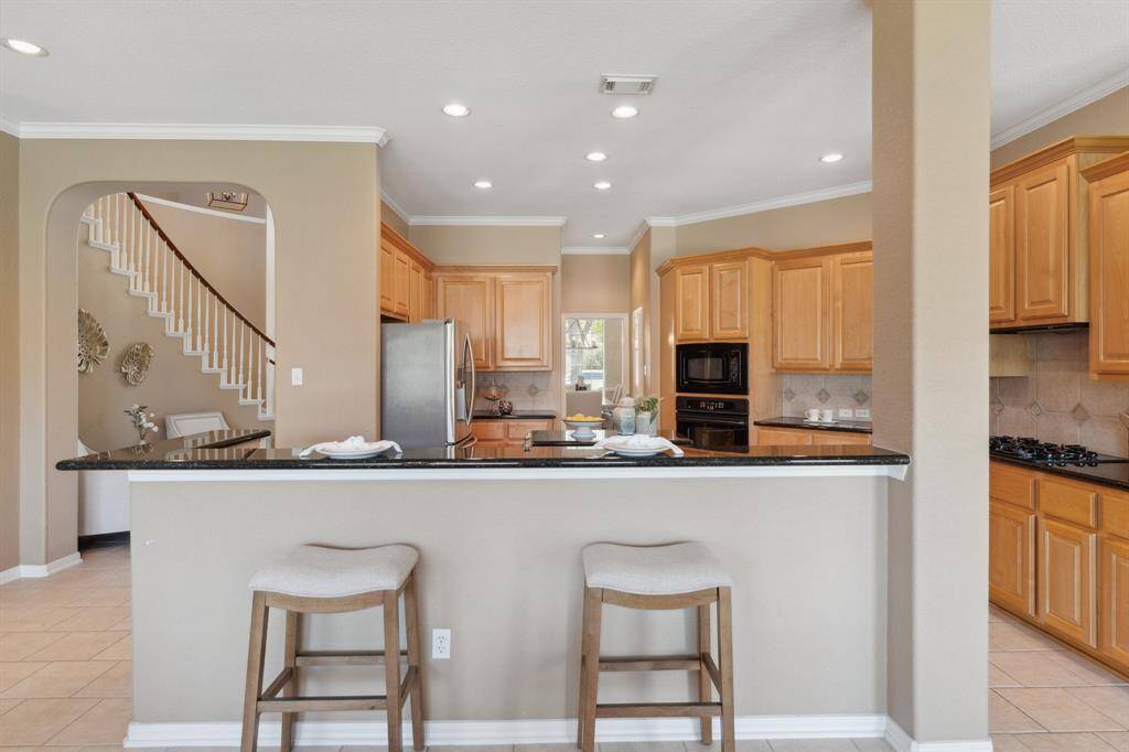 Pull up a seat at the island’s barstool seating—perfect for morning coffee, casual meals, or chatting with the chef.