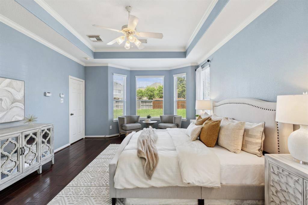 The first floor primary suite is a true retreat.