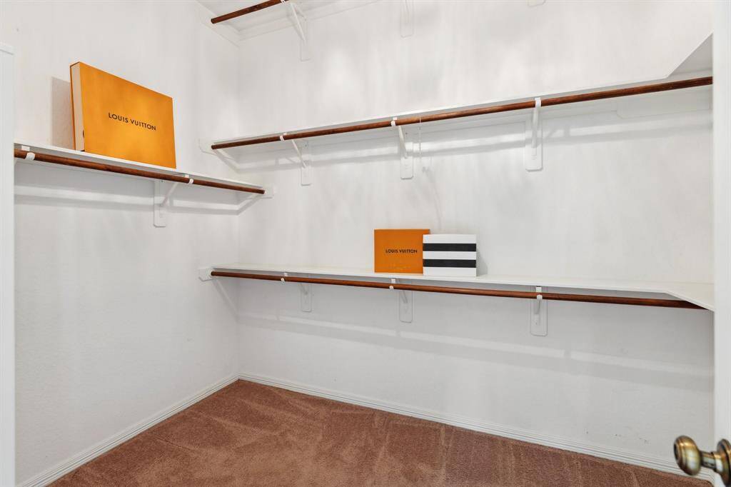 One of two walk-in closets in the primary suite.