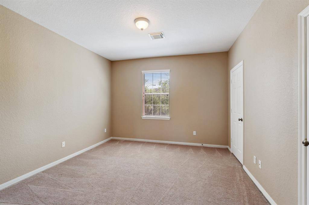 One of the four secondary bedrooms located on the second floor.