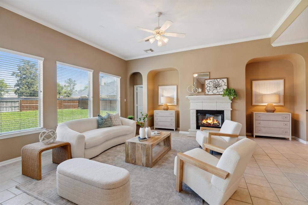 The open-concept floor plan is flooded with natural light, thanks to abundant windows throughout the living areas.