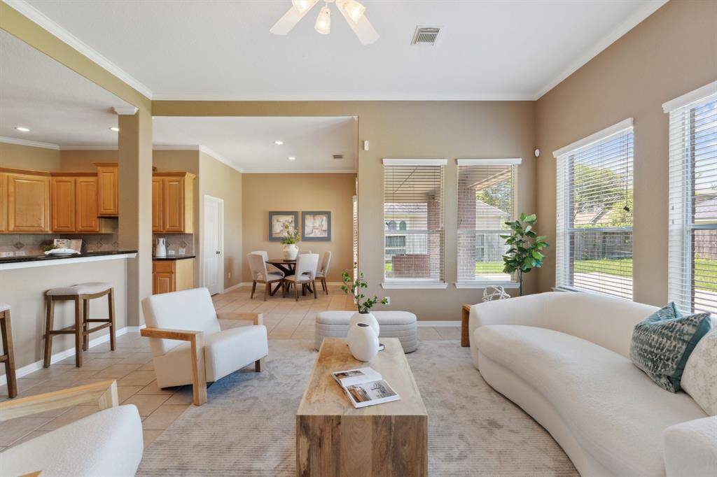 Take in the backyard views from every angle! Addtionally the home features crown molding throughout and whole-house water softener.