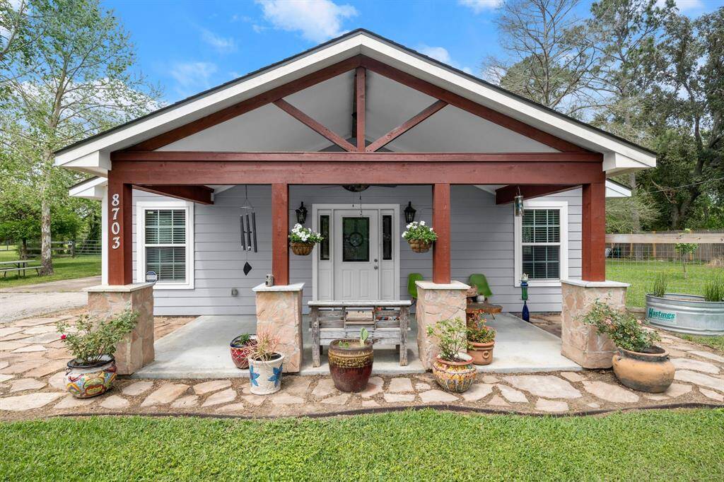 Front of home with large covered patio