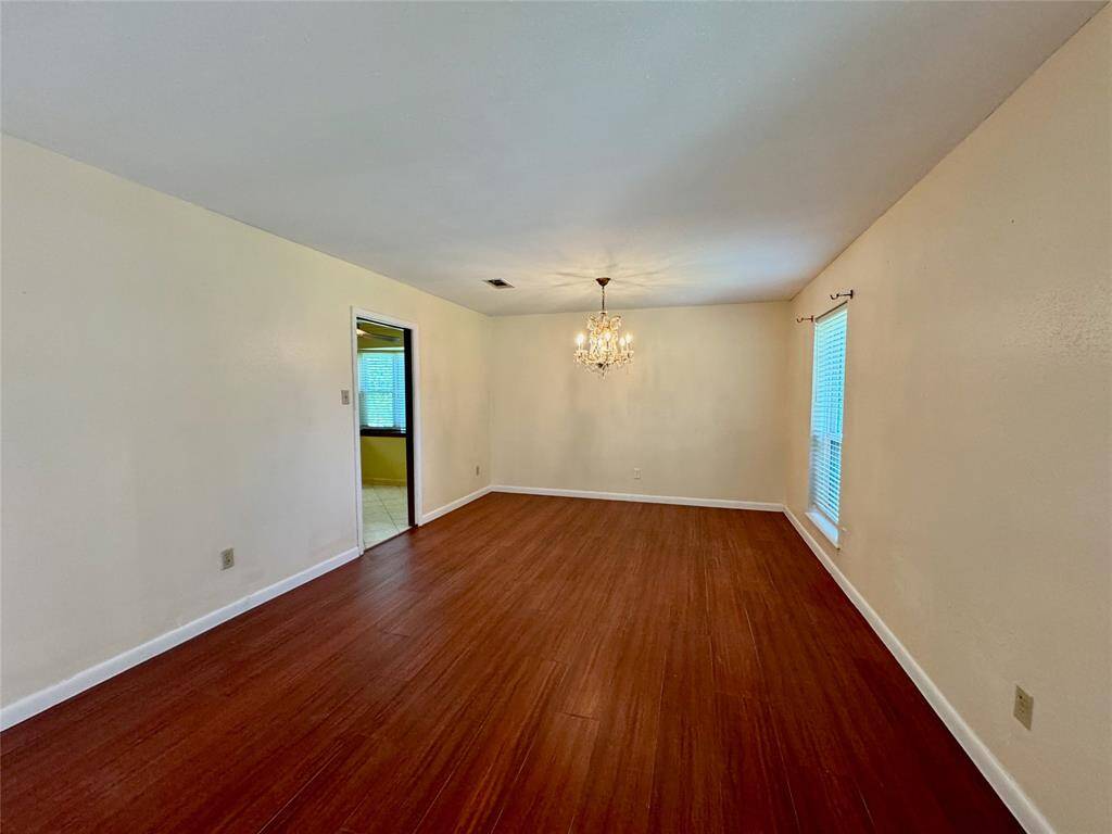 Beautiful formal living/dining area with luxury vinyl plank flooring.