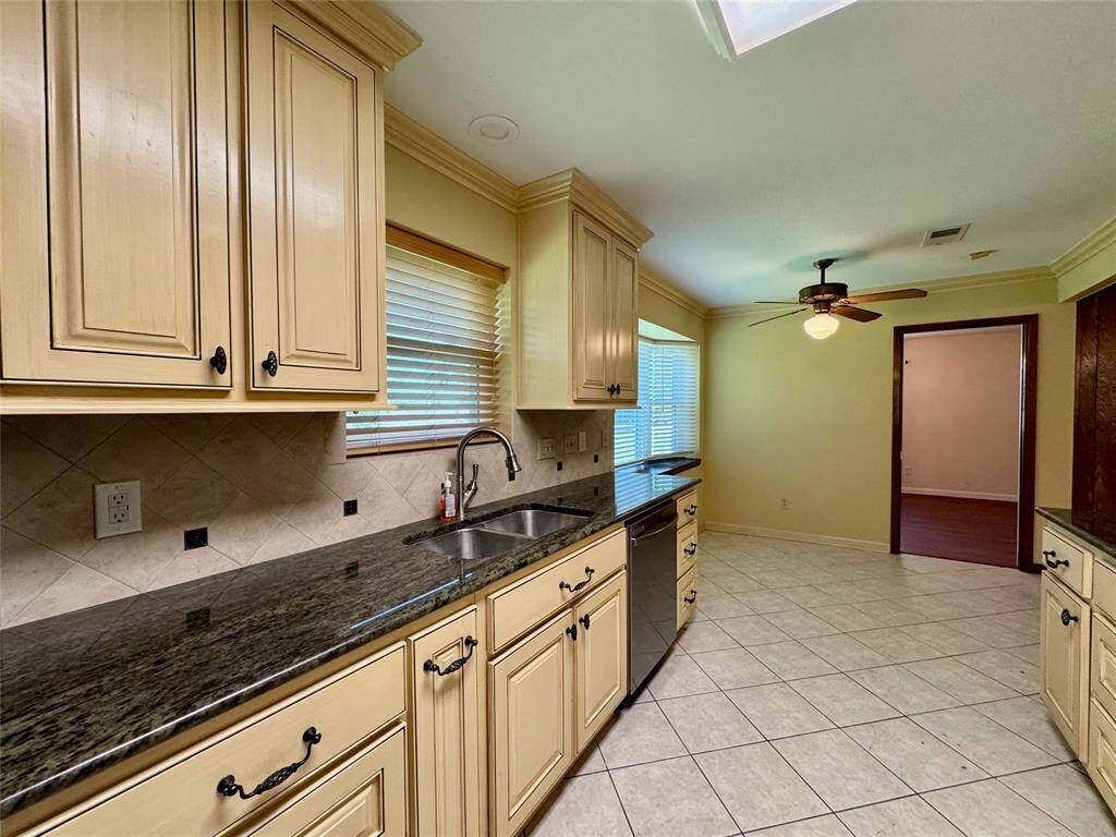 All stainless steel appliances in the kitchen, including gas stove, wall-mounted oven/microwave, dishwasher, and French door refrigerator.