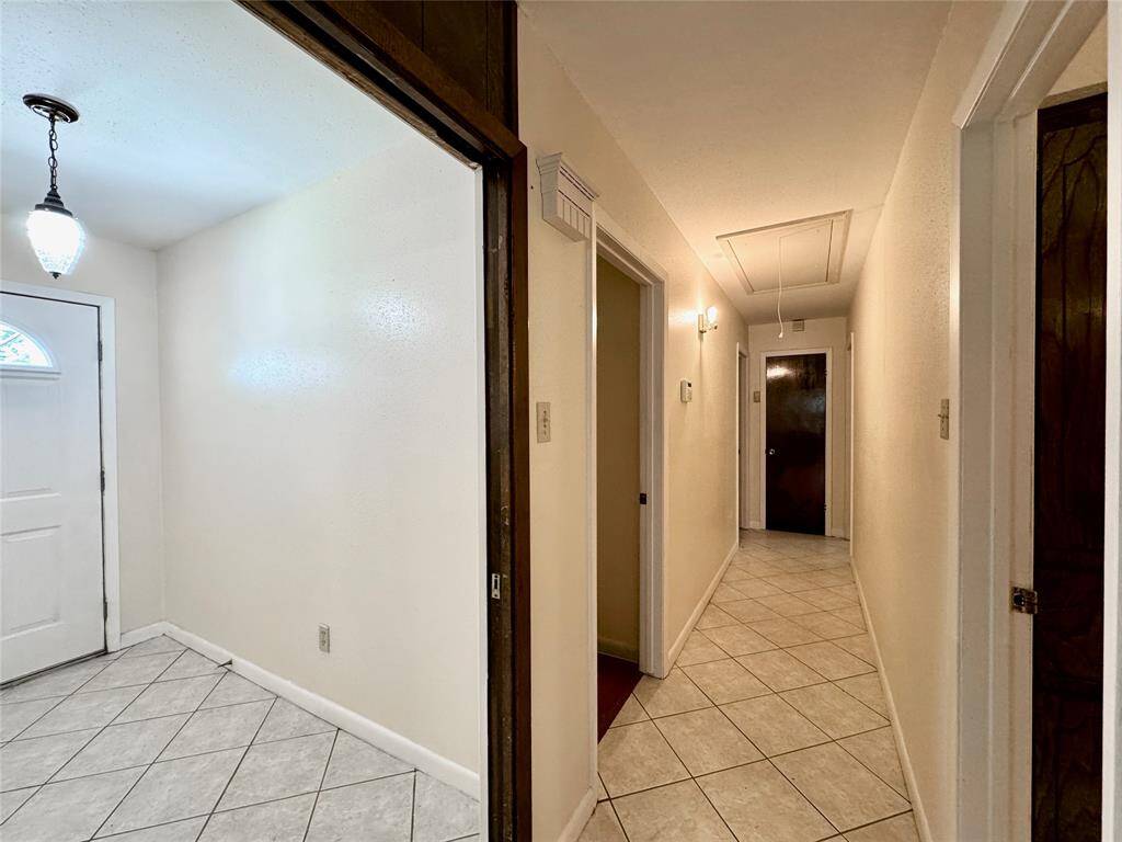 Hallway leading to 3 bedrooms and 2 full baths.