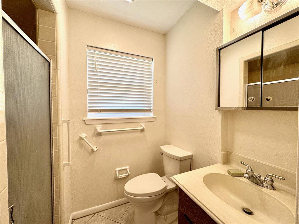 Primary bathroom includes shower stall, commode, and vanity. Vent system recently added!
