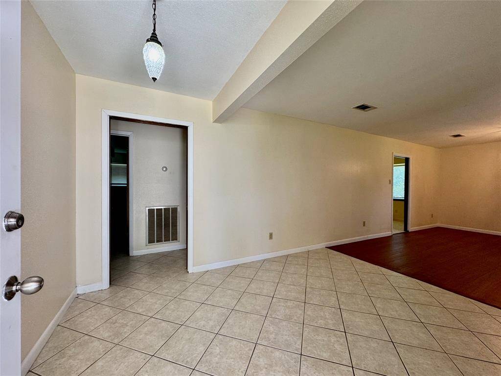 Front entryway welcomes you into a formal living/dining room.