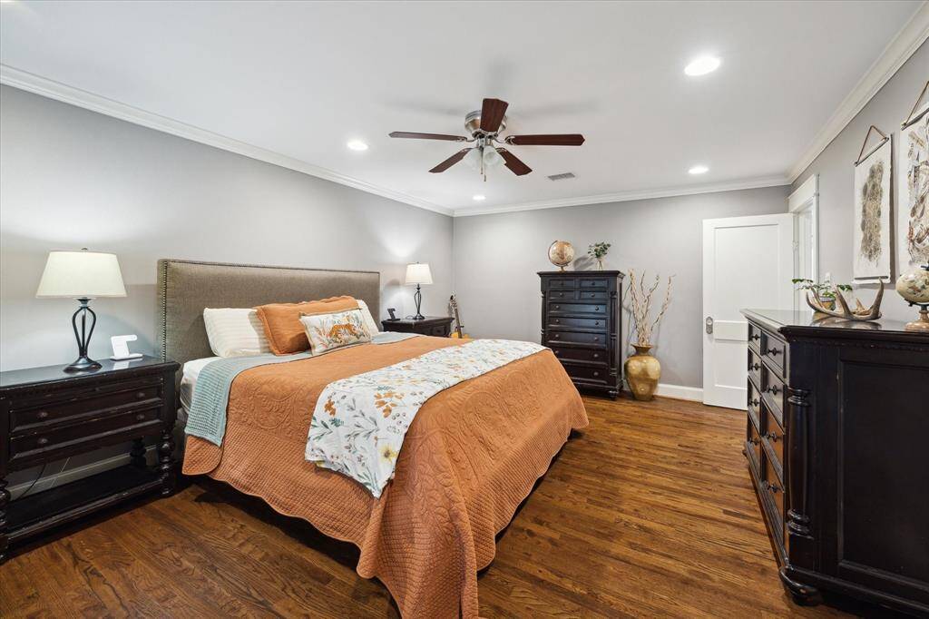 Another view of the large primary bedroom. The door on the right side of the picture leads to the ensuite bath.