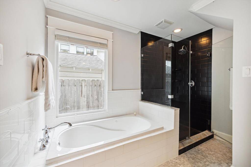 Brighten your day with ultimate relaxation as you unwind in the luxurious jetted tub or the glass enclosed shower.