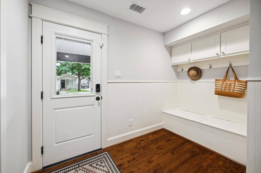 Conveniently located by the backdoor, the mudroom serves as the perfect drop zone to help the rest of the house to remain organized and clutter free.