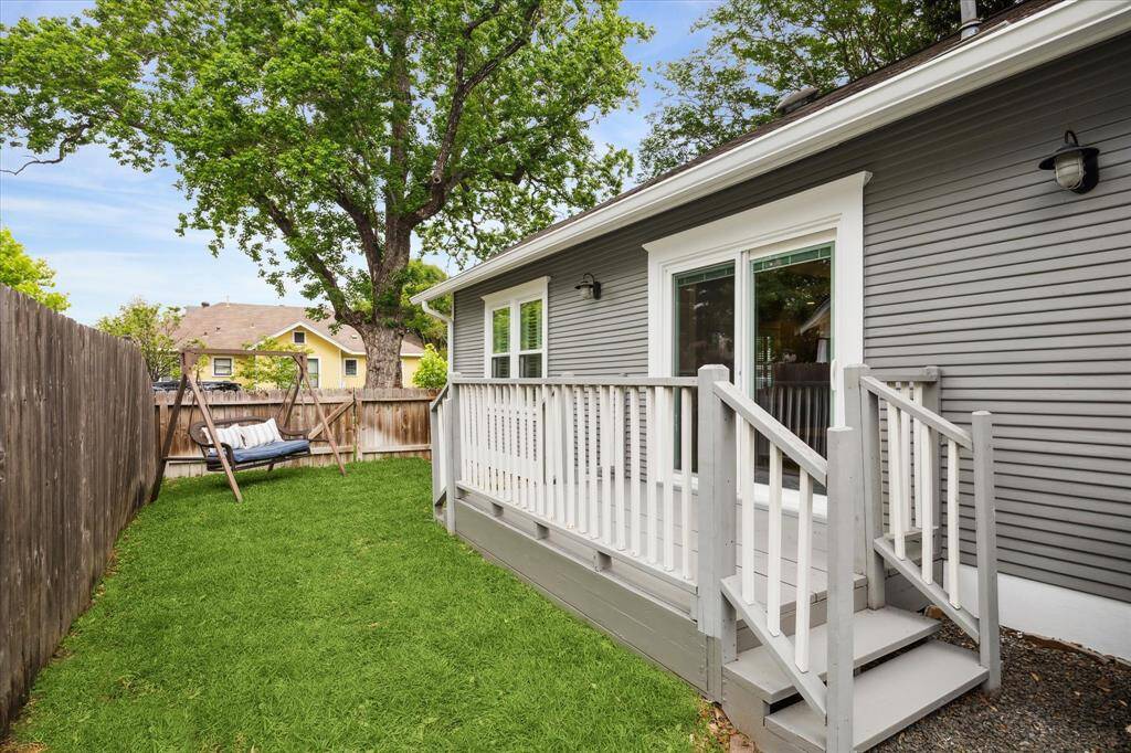 The porch off  the breakfast room leads to the side yard that is the perfect spot to let your pets run and play.