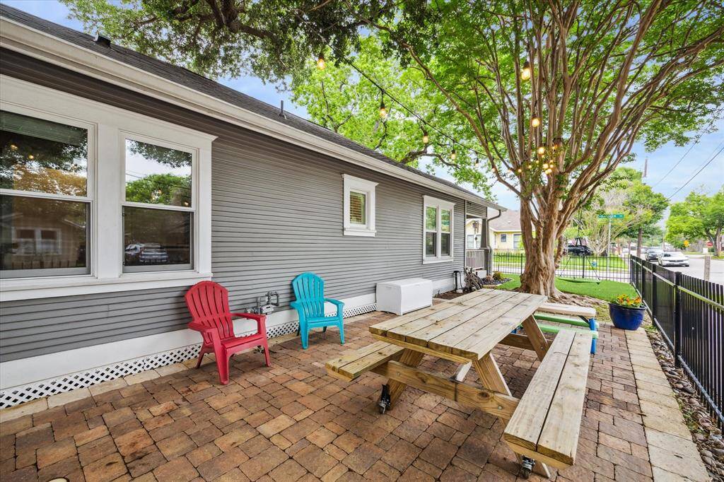 The paver patio (*installed in 2019) is a great spot to enjoy a family meal or watch your loved ones run and play under the 70 year old crepe mertyle. *per seller