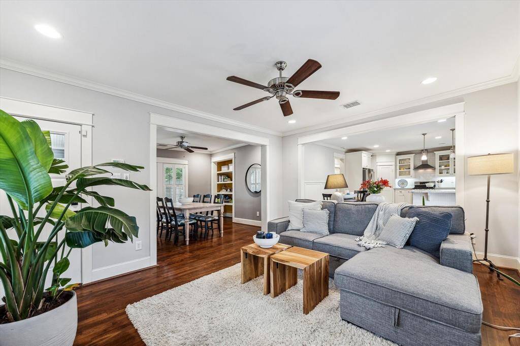 Welcome your guests into this inviting living room bathed in natural light.