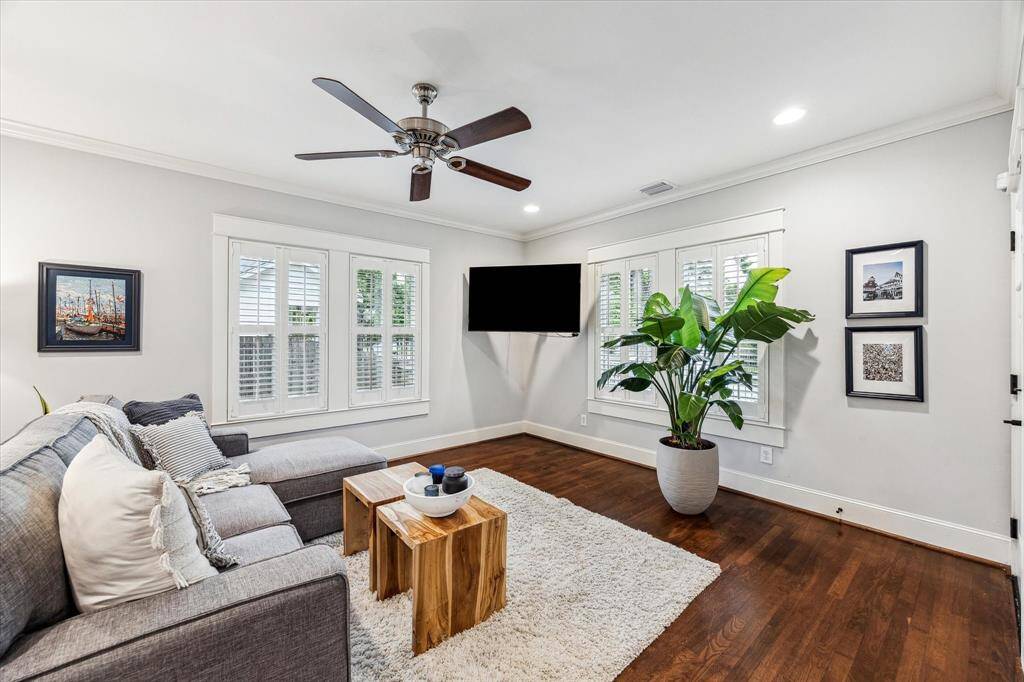 Another view of the spacious living room with gorgeous hardwood floors.