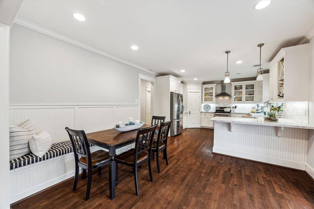 The built-in banquette with storage and custom cushions is the perfect setting for enjoying meals and has the bonus of hidden storage!